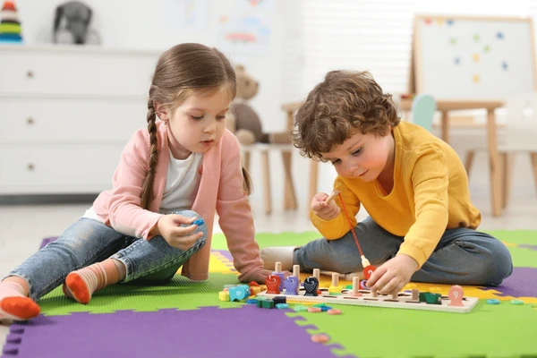 Children play on a play mat